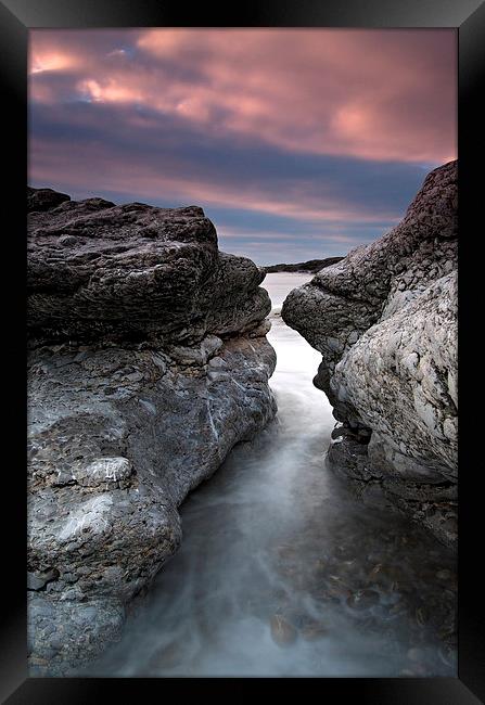 A Face in the rocks Framed Print by David Stephens