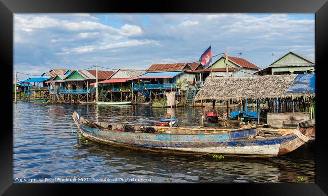 Stilt Village in Tonle Sap Lake Cambodia Framed Print by Pearl Bucknall