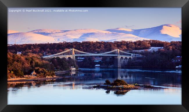 Menai Bridge and Snowdonia from Anglesey in Winter Framed Print by Pearl Bucknall