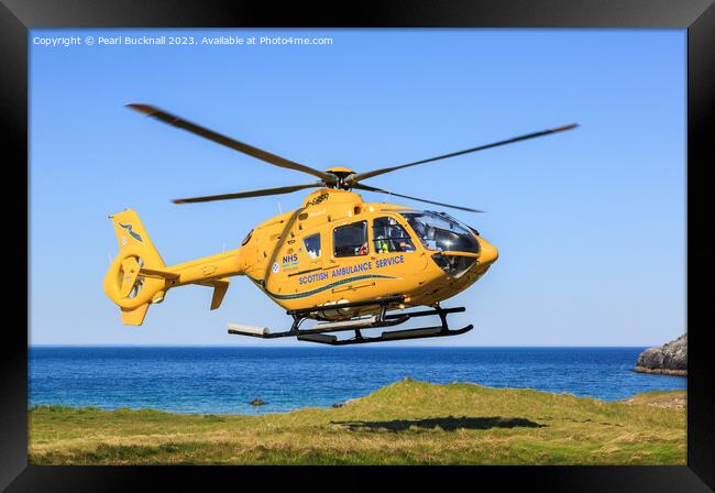 Scottish Ambulance Helicopter Lifting Off Framed Print by Pearl Bucknall