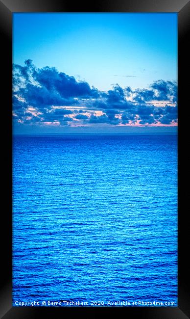 Clouds over the sea, blue hour, Gower, Wales, UK Framed Print by Bernd Tschakert
