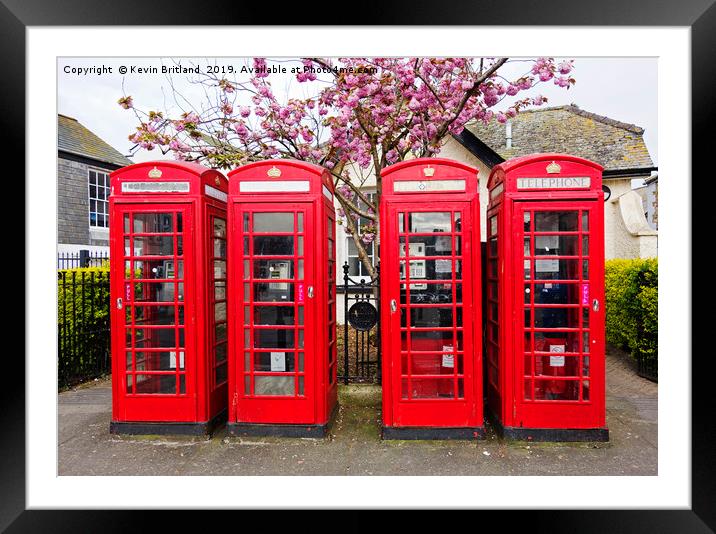red telephone boxes  Framed Mounted Print by Kevin Britland
