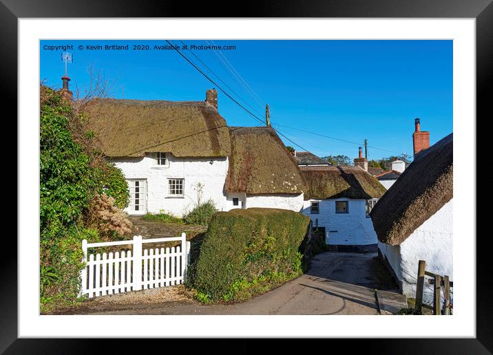 Thatched roof cottages Framed Mounted Print by Kevin Britland