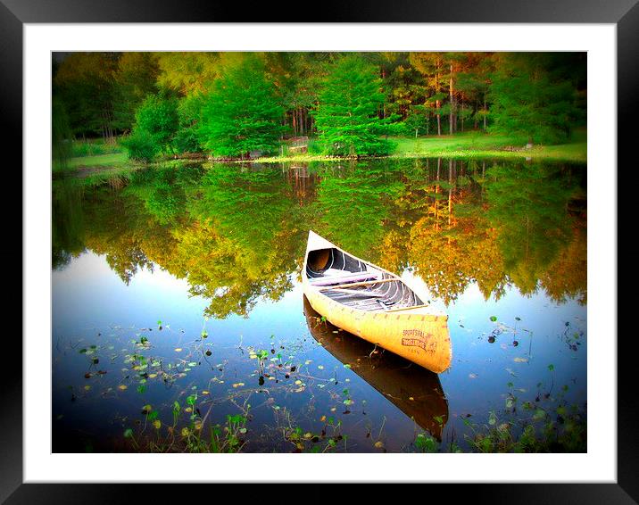 canoe  on the water Framed Mounted Print by Daniel Kesh