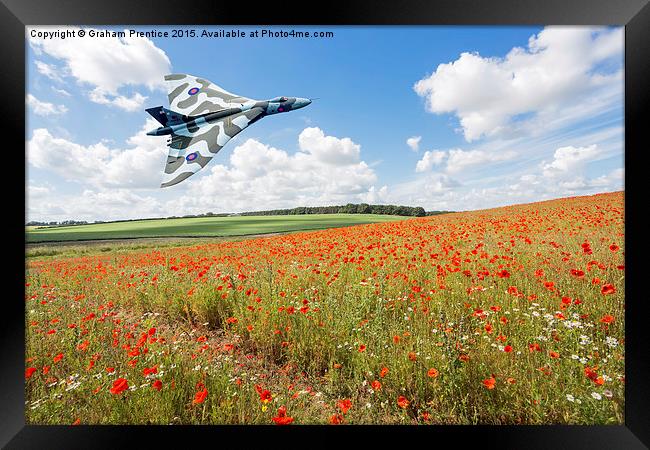  Avro Vulcan B2 bomber in flight over a poppy fiel Framed Print by Graham Prentice