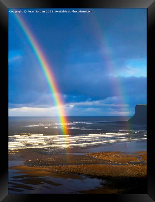 Saltburn Beach  in winter sunshine blue sky  with a double rainbow and a  distant view of looking towards Warsett hill  Framed Print by Peter Jordan