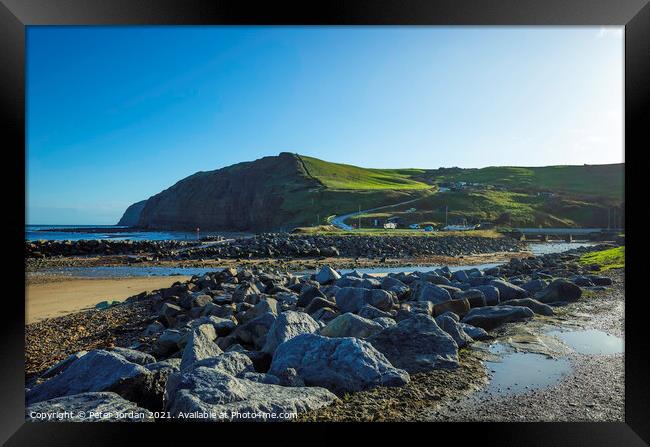 Beaches at Skinningrove North Yorkshire England UK have rock armour to prevent erosion Framed Print by Peter Jordan