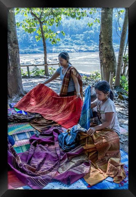 Preparing cloth for market, Laos. Framed Print by Robert Murray