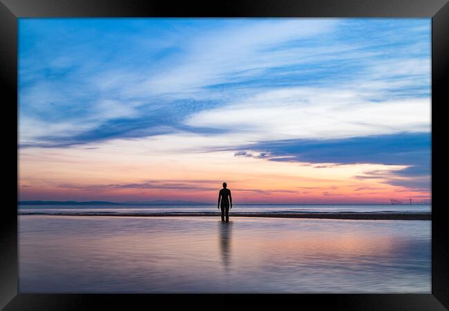An Iron Man rising from the sea Framed Print by Jason Wells