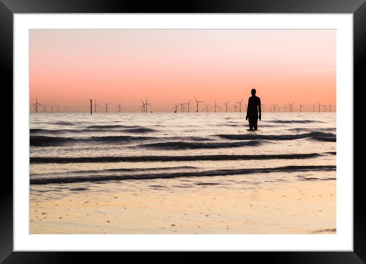 Waves lap up around an Iron Man Framed Mounted Print by Jason Wells