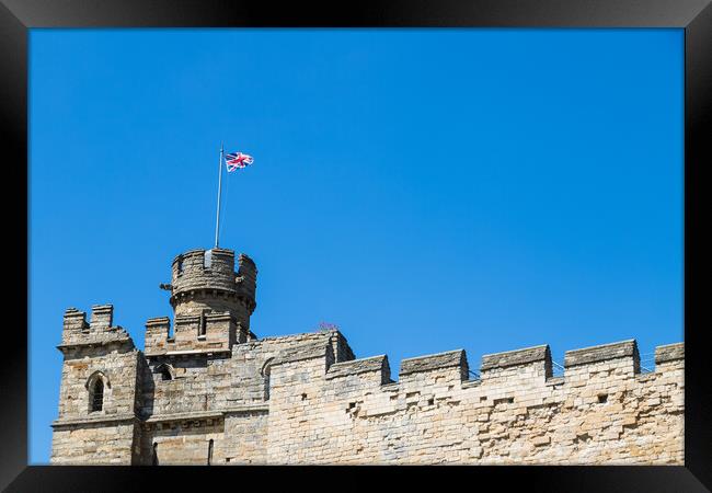 Union Jack above Lincoln castle Framed Print by Jason Wells