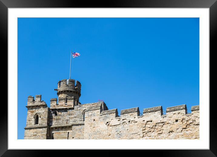 Union Jack above Lincoln castle Framed Mounted Print by Jason Wells