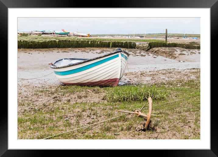 Boat anchored to the shore at Brancaster Staithe Framed Mounted Print by Jason Wells
