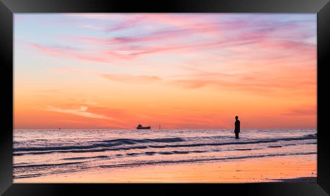 Iron Man watching a boat go out into the Irish Sea Framed Print by Jason Wells