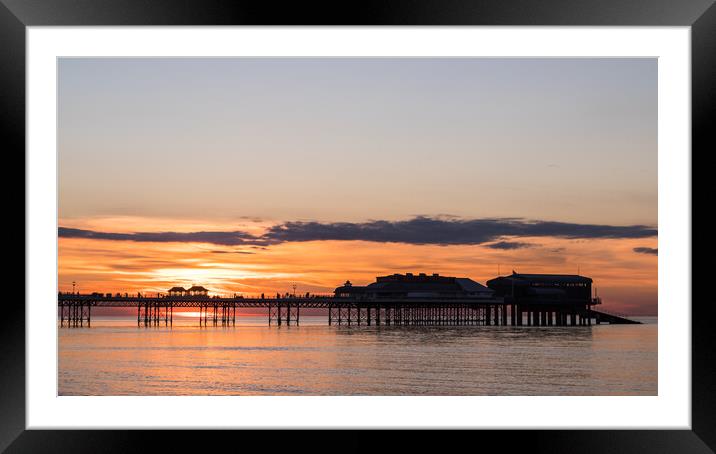 Sunset behind Cromer Pier Framed Mounted Print by Jason Wells