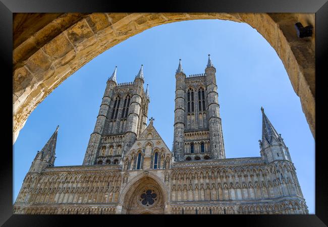 Looking through an archway at Lincoln cathedral Framed Print by Jason Wells