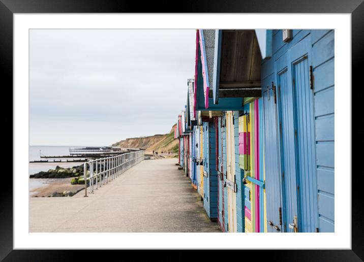 Beach huts on the promenade at Sheringham Framed Mounted Print by Jason Wells