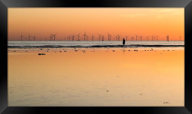 Still waters behind an Iron Man at sunset Framed Print by Jason Wells
