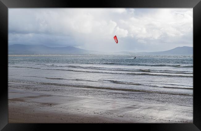 Kite surfer on the Anglesey coast Framed Print by Jason Wells