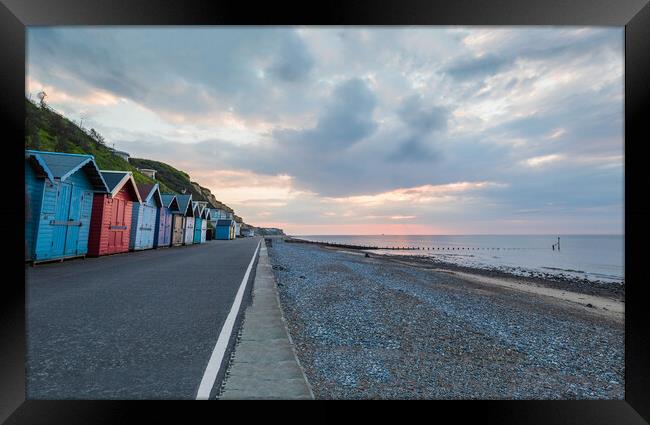 Beach huts along the Cromer seafront Framed Print by Jason Wells