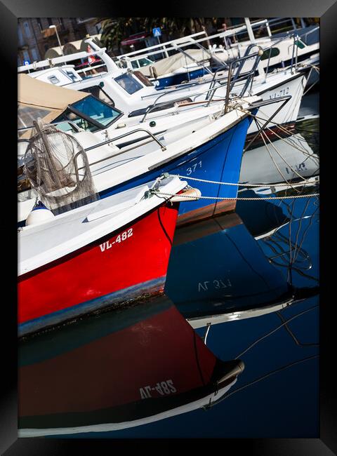 Boats reflecting in the water Framed Print by Jason Wells