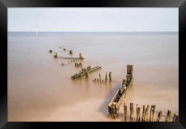 Zig zag groyne at Hunstanton beach juts out into The Wash Framed Print by Jason Wells