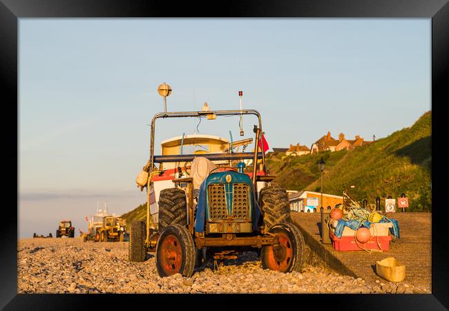 Tractors and boats at sunset Framed Print by Jason Wells