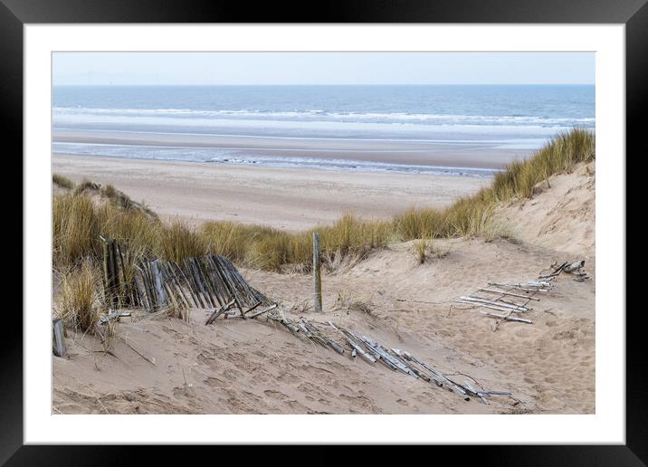 Fallen fence leading down to Formby beach Framed Mounted Print by Jason Wells