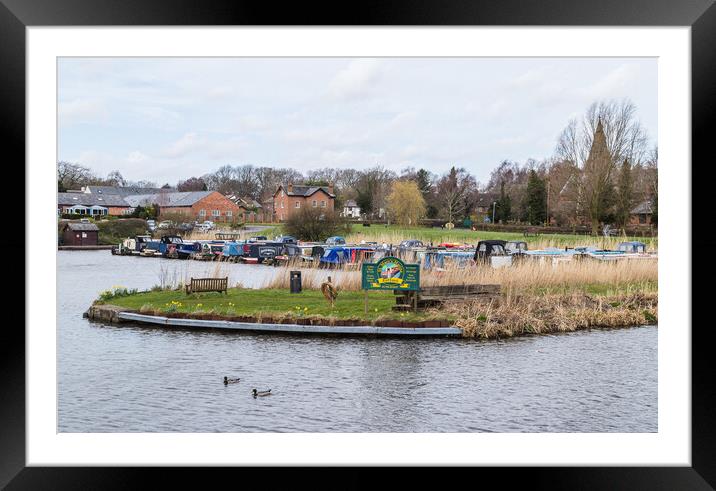 Ducks swimming passed St Mary's Marina Framed Mounted Print by Jason Wells