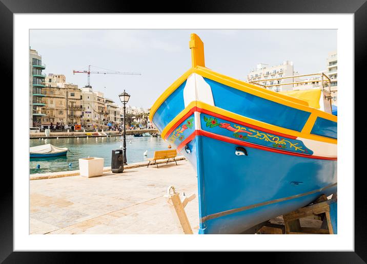 Luzzu boat on the edge of Spinola Bay Framed Mounted Print by Jason Wells