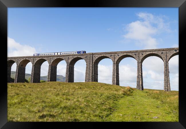 Train passing over the Ribblehead Viaduct  Framed Print by Jason Wells