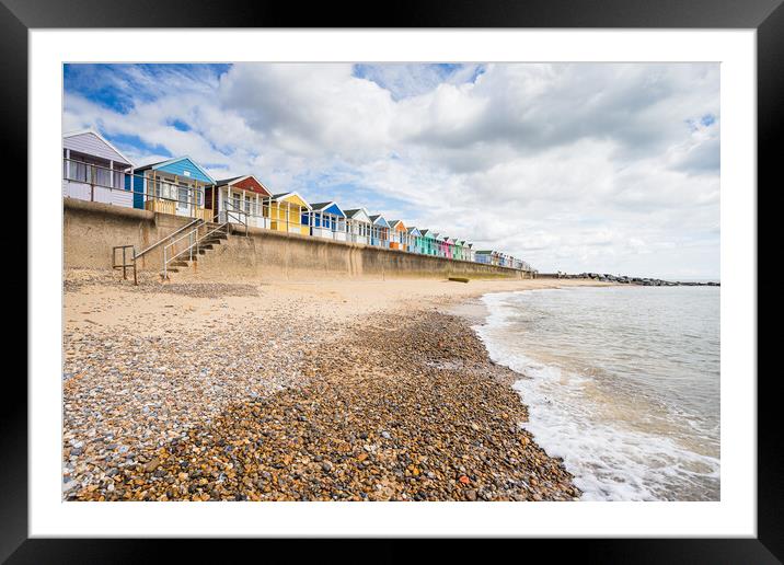 Southwold beach huts next to the pier Framed Mounted Print by Jason Wells