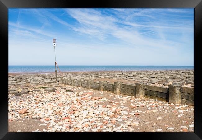 Red and white rocks on Hunstanton beach Framed Print by Jason Wells