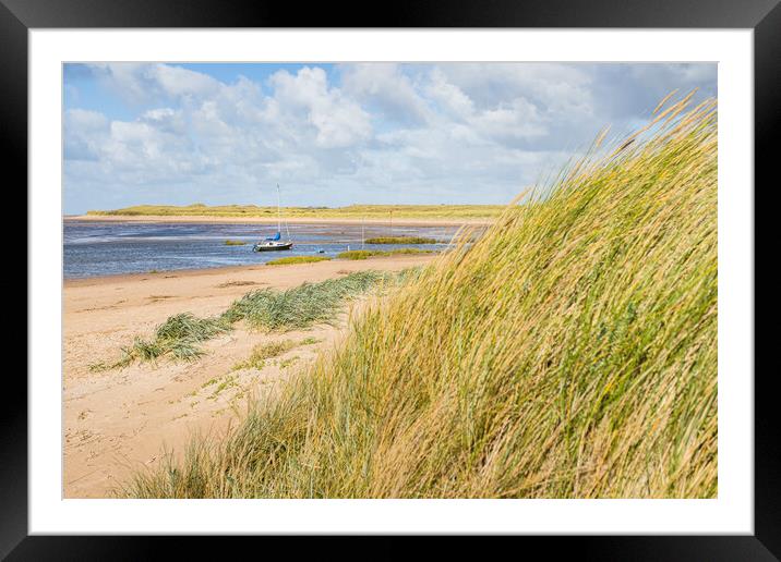 Yacht moored off Hightown beach Framed Mounted Print by Jason Wells