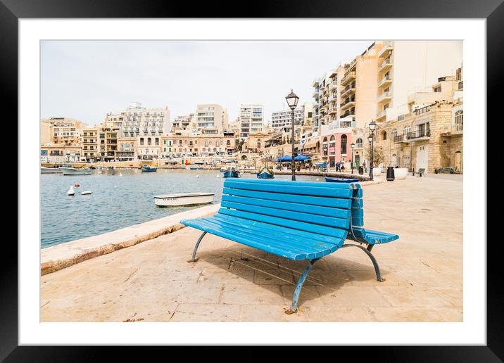 Blue bench on the promenade at Spinola Bay Framed Mounted Print by Jason Wells