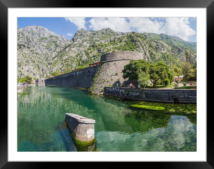 Tourists sit next to the moat in Kotor Framed Mounted Print by Jason Wells