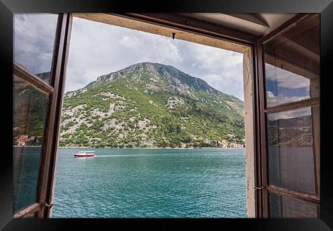 Boat travels along the Bay of Kotor Framed Print by Jason Wells