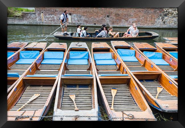 Tourists pass a row of punts Framed Print by Jason Wells
