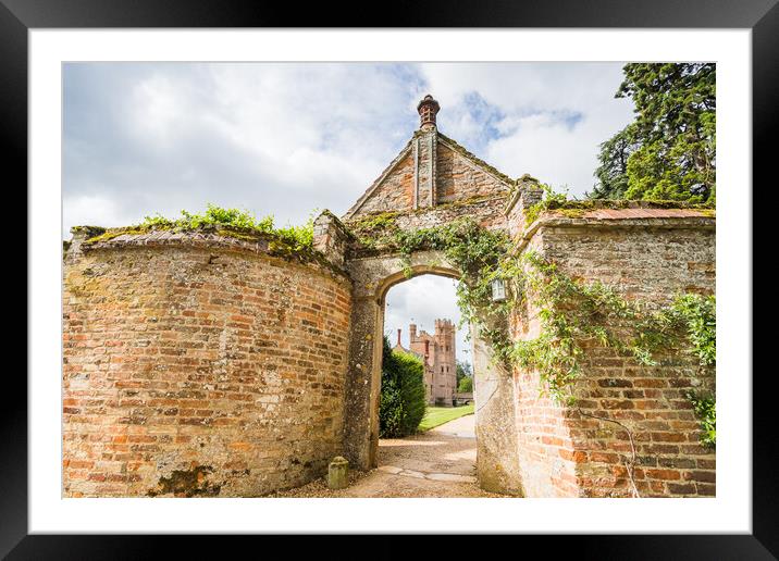 Oxburgh Hall through an arch Framed Mounted Print by Jason Wells