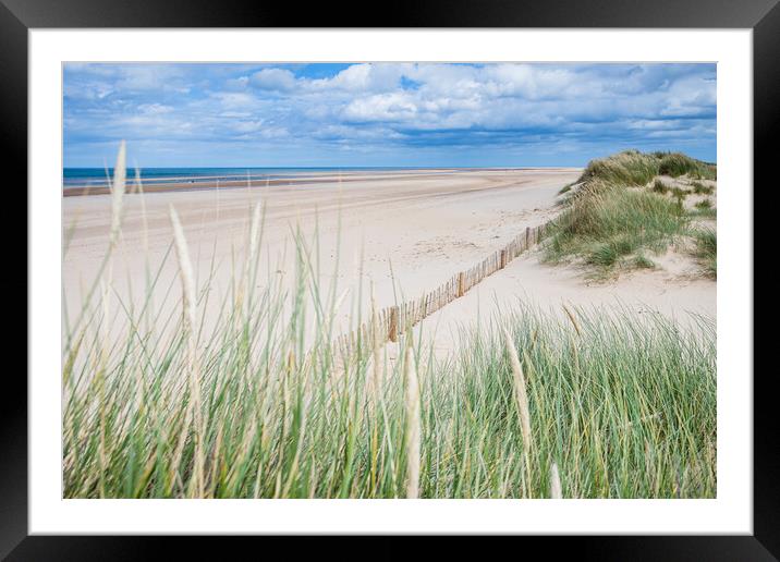 Holkham beach behind dune grass Framed Mounted Print by Jason Wells