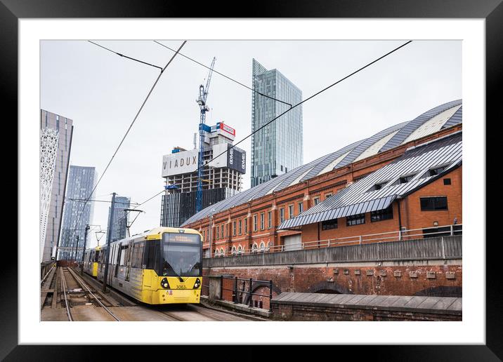 Metrolink tram approaching Manchester city centre Framed Mounted Print by Jason Wells