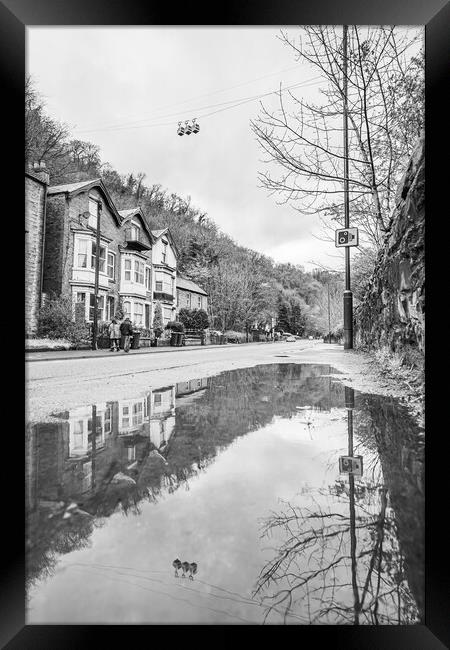 Cable cars reflecting in a puddle Framed Print by Jason Wells