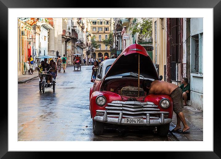Local man working under the bonnet Framed Mounted Print by Jason Wells