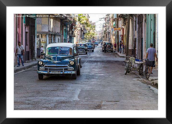 Facing a line of taxi's in Centro Havana Framed Mounted Print by Jason Wells