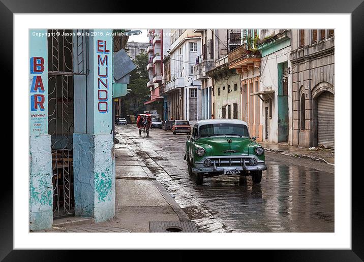Car passing El Mundo bar Framed Mounted Print by Jason Wells