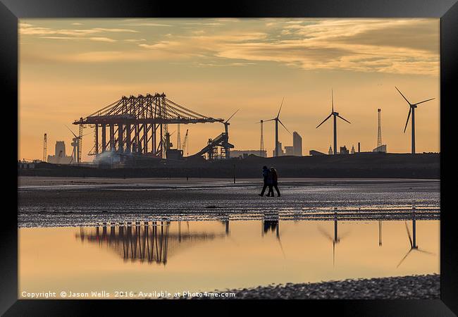 Reflection of people walking on the beach Framed Print by Jason Wells