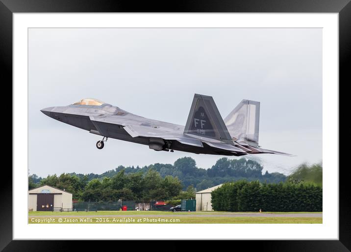 F-22A Raptor lifts it's landing gear as it exits t Framed Mounted Print by Jason Wells