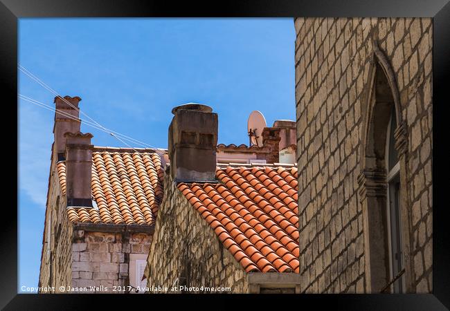 Looking up at Dubrovnik's colourful buildings Framed Print by Jason Wells
