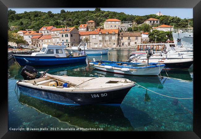 Boats moored off the promenade in Sipan Framed Print by Jason Wells