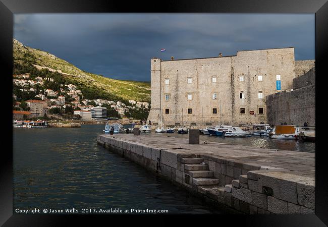 Stormy skies behind St John’s Fortress Framed Print by Jason Wells